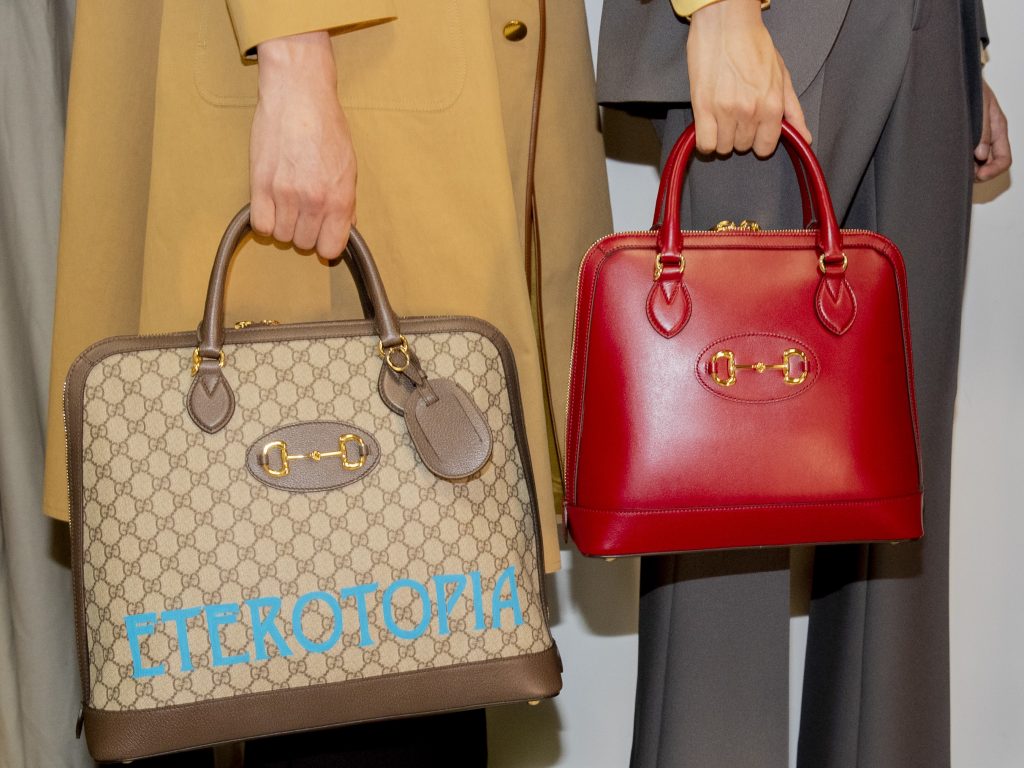 Hilary's casual look is complemented with a relaxed bright red LV embossed  bag with gold hardware.CELEBS RO…